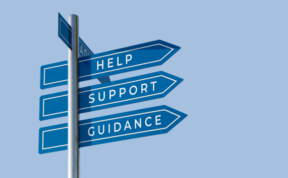 Other sources of support A signpost with three directional signs visible that read help, support, and guidance
